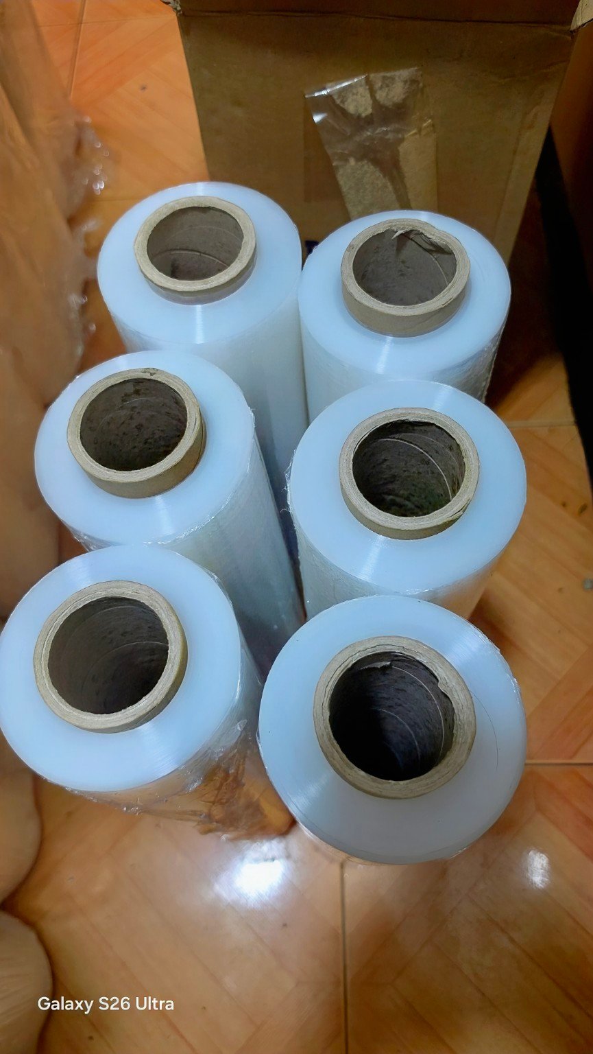 Top view of grouped clear stretch film rolls showing roll cores